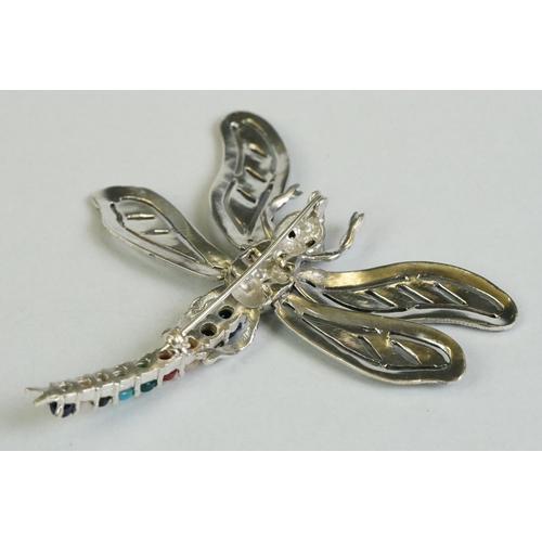 356 - A silver dragonfly brooch set with marcasites, sapphires, rubies etc