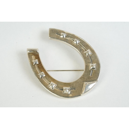 360 - A large silver horseshoe brooch