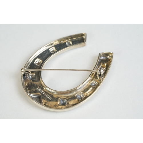 360 - A large silver horseshoe brooch