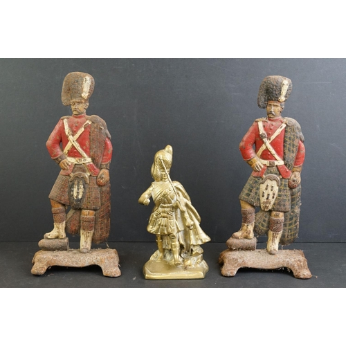 477 - Pair of cast iron painted door stops modelled as Highland Regiment soldiers, 30cm high, together wit... 