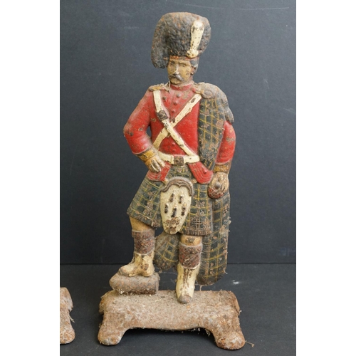 477 - Pair of cast iron painted door stops modelled as Highland Regiment soldiers, 30cm high, together wit... 