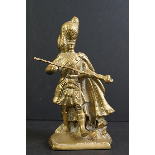 477 - Pair of cast iron painted door stops modelled as Highland Regiment soldiers, 30cm high, together wit... 