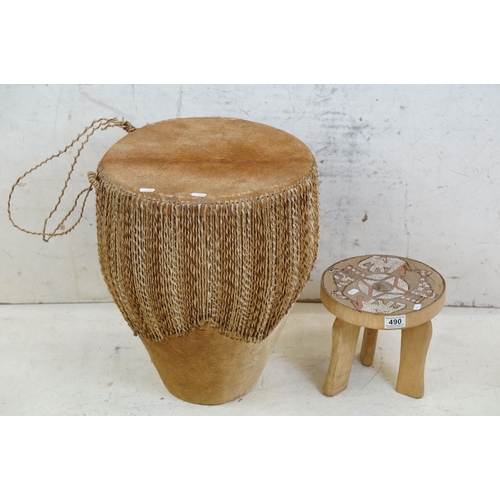 490 - African cowhide bongo drum with twine fastenings, 47cm high, together with a small African beadwork ... 