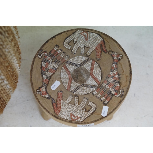 490 - African cowhide bongo drum with twine fastenings, 47cm high, together with a small African beadwork ... 