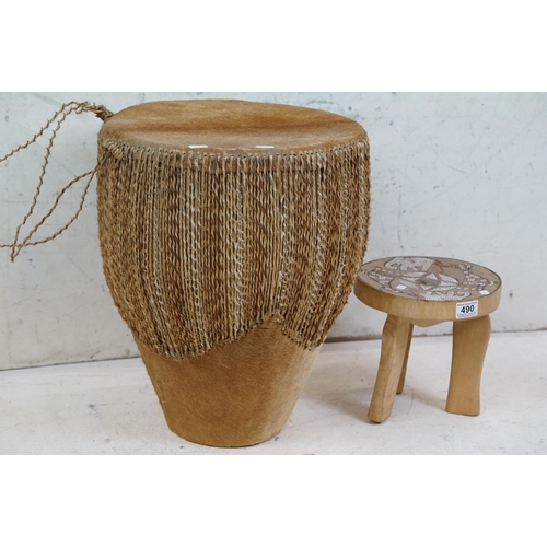 490 - African cowhide bongo drum with twine fastenings, 47cm high, together with a small African beadwork ... 