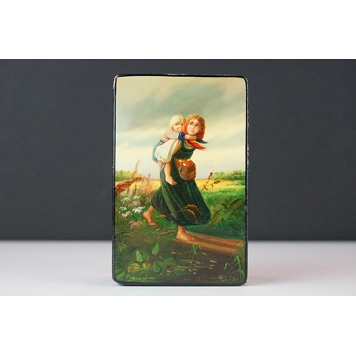 362 - A Russian lacquer box, signed Podwchicko (?) with a young mother carrying her child on her back, 10 ... 