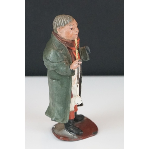 369 - A had painted lead figure in the form of Mr pickwick together with a carved wooden buddha.