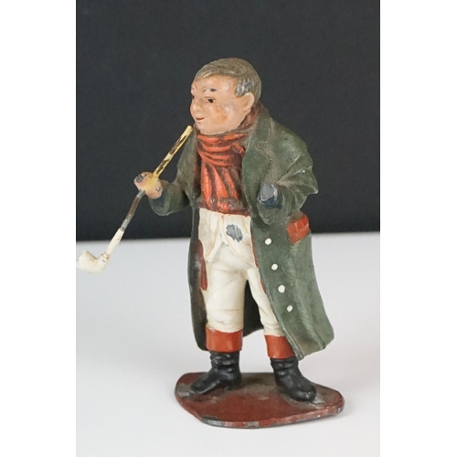 369 - A had painted lead figure in the form of Mr pickwick together with a carved wooden buddha.