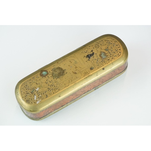 375 - An antique 18th century brass and copper snuff box with ornate chased decoration.