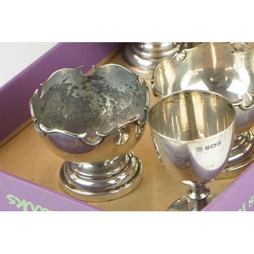 388 - A miniature silver goblet or chalice, Sheffield 1934, together with a group of silver condiments, 24... 