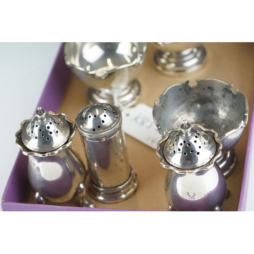 388 - A miniature silver goblet or chalice, Sheffield 1934, together with a group of silver condiments, 24... 