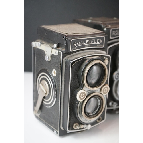 397 - A collection of mainly mid 20th century twin lens reflex cameras to include Rollei examples.