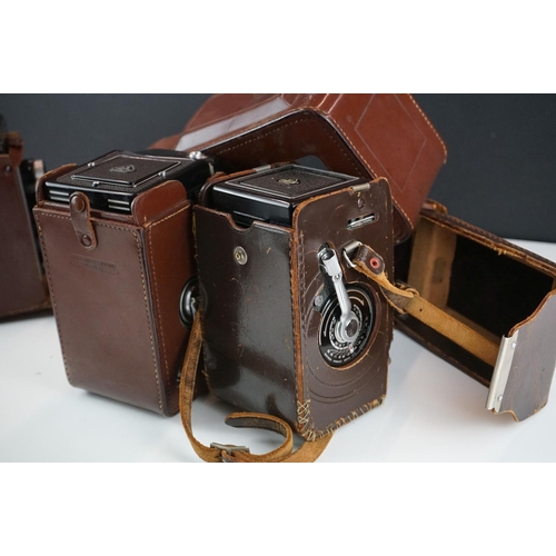 397 - A collection of mainly mid 20th century twin lens reflex cameras to include Rollei examples.