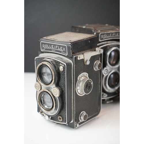 397 - A collection of mainly mid 20th century twin lens reflex cameras to include Rollei examples.