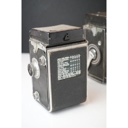 397 - A collection of mainly mid 20th century twin lens reflex cameras to include Rollei examples.