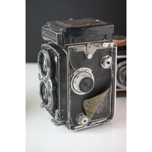 397 - A collection of mainly mid 20th century twin lens reflex cameras to include Rollei examples.