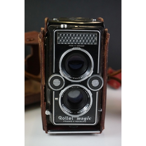 397 - A collection of mainly mid 20th century twin lens reflex cameras to include Rollei examples.