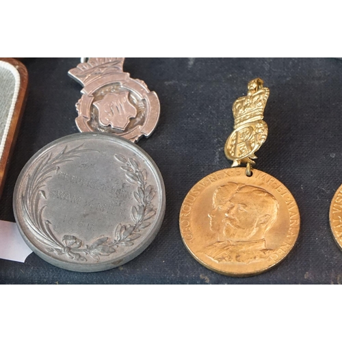 398 - A small group of collectables contained within a vintage case to include medals and hallmarked silve... 