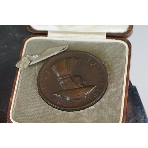 398 - A small group of collectables contained within a vintage case to include medals and hallmarked silve... 