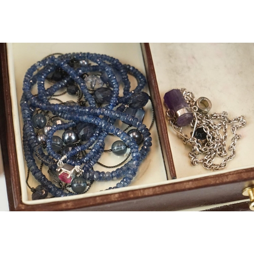 399 - A collection of vintage and contemporary costume jewellery to include gold and silver examples.