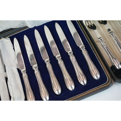 403 - Two cased sets of hallmarked silver handled cutlery to include fish knives and forks.