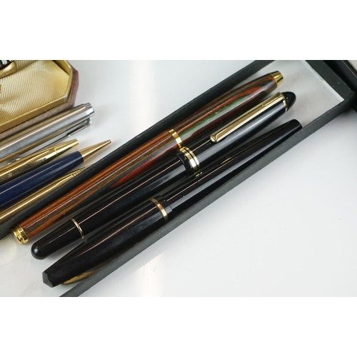 413 - A collection of mixed pens to include Conway Stewart, Sheaffer and Waterman examples.