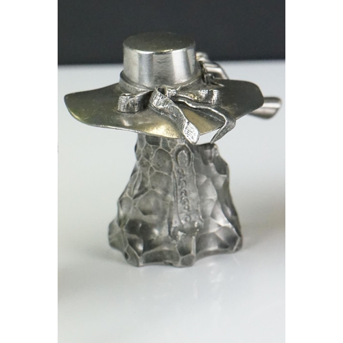 414 - A collection of four contemporary white metal hat ornaments, maker marked to verso.