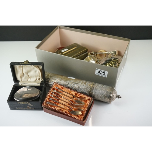 423 - A box of mixed collectables to include a cased silver topped brush, hallmarked silver mirror, brass ... 