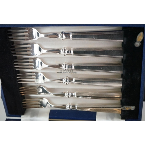 425 - A cased set of silver plated fish knives and forks.