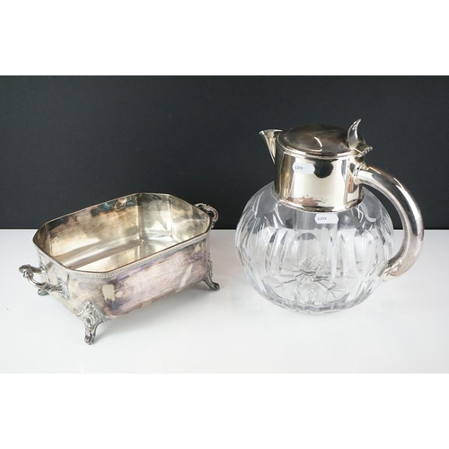 426 - A mid 20th century silver plated cut glass lemonade / cocktail cooling cooling jug together with a w... 