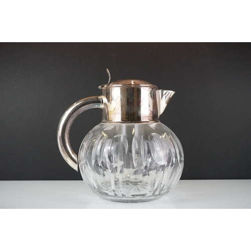 426 - A mid 20th century silver plated cut glass lemonade / cocktail cooling cooling jug together with a w... 