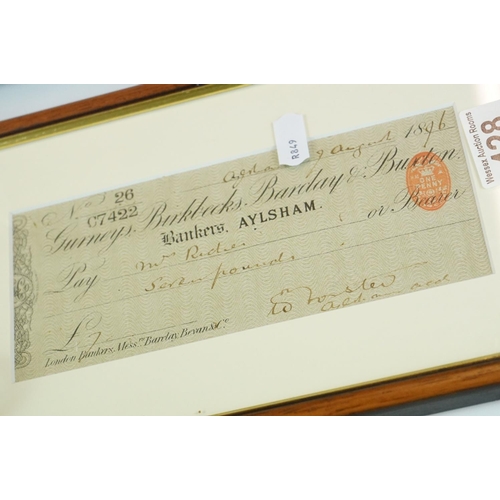 428 - A small group of mixed collectables to include watches, a framed cheque dated 1896, a clock and a co... 