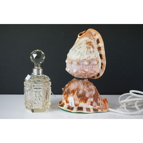 429 - A cut glass scent bottle with hallmarked sterling silver collar together with a cameo shell lamp.