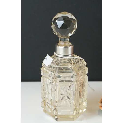 429 - A cut glass scent bottle with hallmarked sterling silver collar together with a cameo shell lamp.