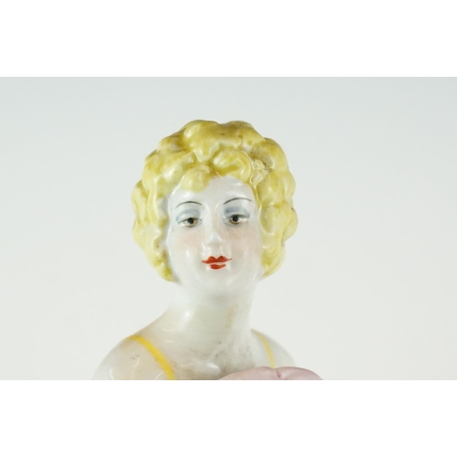 430 - A ceramic Art Deco style pin doll in the form of an Art Deco figure