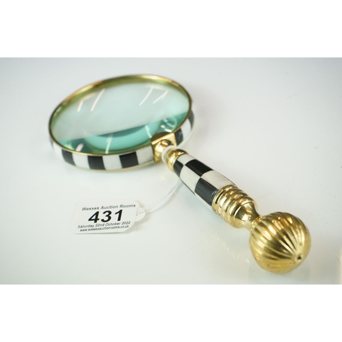 431 - A large hand-held magnifying glass with checkerboards handle