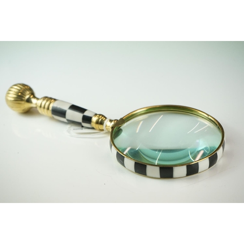 431 - A large hand-held magnifying glass with checkerboards handle