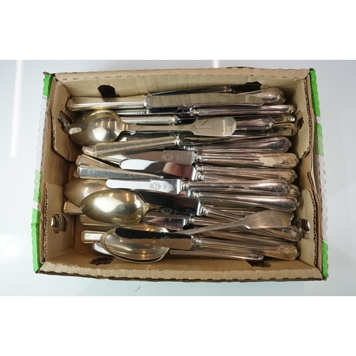 434 - A collection of silver plated cutlery to include spoons and butter knives.