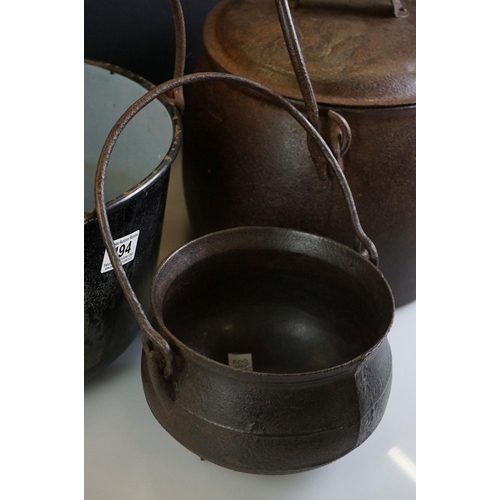 494 - 19th century Large Cast Iron Cooking Pot plus two others