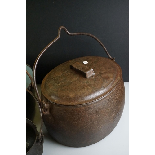 494 - 19th century Large Cast Iron Cooking Pot plus two others