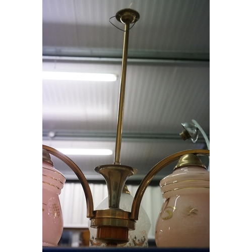 459 - Brass three-branch ceiling light fitting with three light shades (2 pink opaque glass shades and a m... 