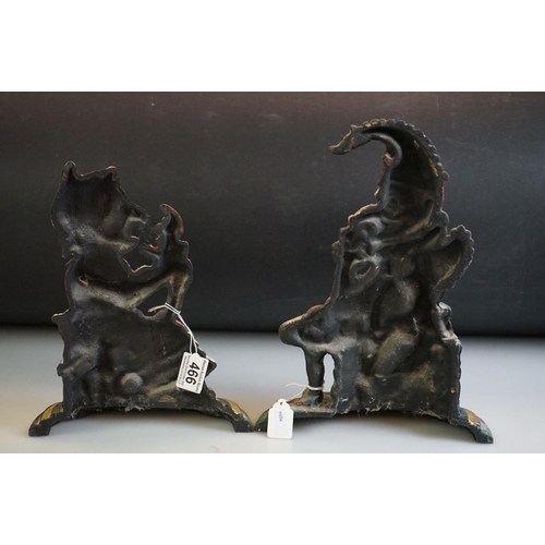 466 - Pair of cast iron Punch and Judy painted doorstops on stepped bases, measure 30cm and 27cm high resp... 