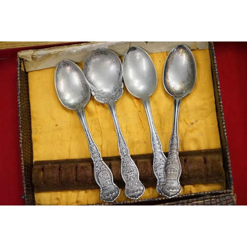 395 - A large collection of mainly silver plated collectors tea spoons contained within six wooden boxes.