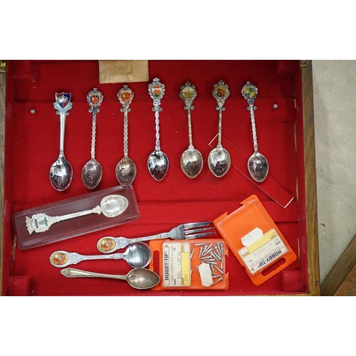 395 - A large collection of mainly silver plated collectors tea spoons contained within six wooden boxes.