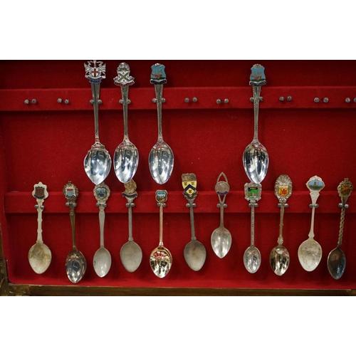 395 - A large collection of mainly silver plated collectors tea spoons contained within six wooden boxes.