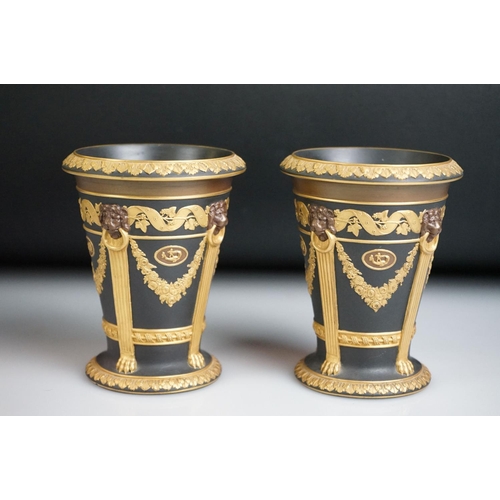 5A - Pair of Wedgwood Black Basalt Gilt tapering vases, decorated with relief floral decoration and brown... 