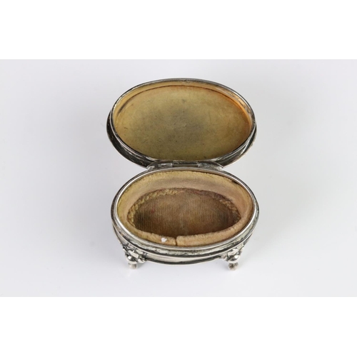 363A - A fully hallmarked sterling silver trinket box set on four feet with hinged lid together with a pair... 