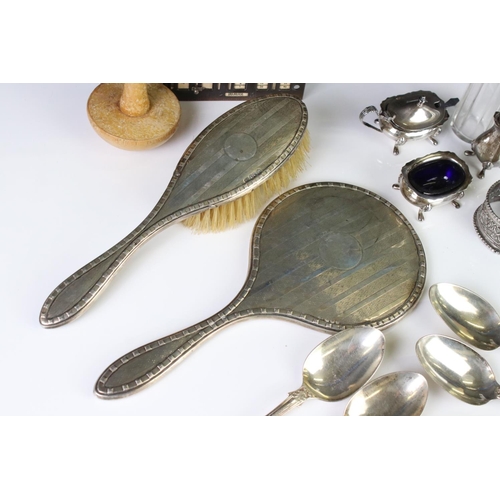 400A - A collection of fully hallmarked sterling silver to include hand mirror, brush, cruet set and table ... 