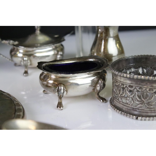 400A - A collection of fully hallmarked sterling silver to include hand mirror, brush, cruet set and table ... 