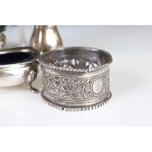 400A - A collection of fully hallmarked sterling silver to include hand mirror, brush, cruet set and table ... 